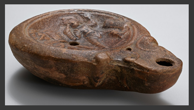 Ancient lamp illustrating gladiators in combat